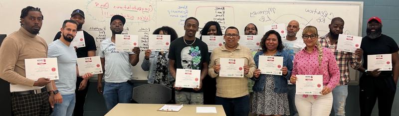 continuing education students holding up certificates